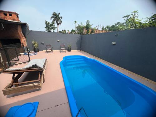 a large blue swimming pool on a patio at Litoral Apart in Eldorado