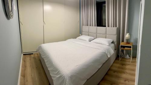 Tempat tidur dalam kamar di Zoi's Apartment