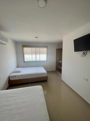 Ένα ή περισσότερα κρεβάτια σε δωμάτιο στο Apartamentos VIOLETTA