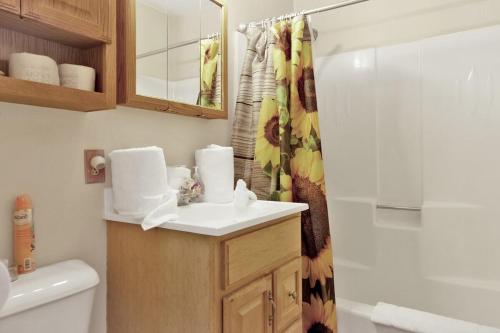 a bathroom with a sink and a shower at Reality Escape by Big Bear Vacations in Big Bear City