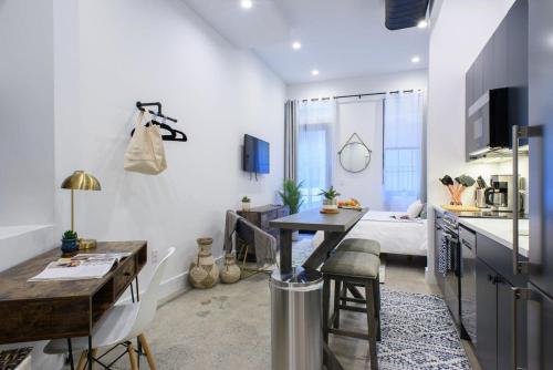 a kitchen and living room with a table and a bed at 3-2 Prime East Village Private outdoor in New York