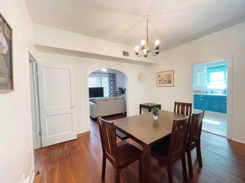 a dining room and living room with a table and chairs at Southern Comfort Oasis in Beaumont