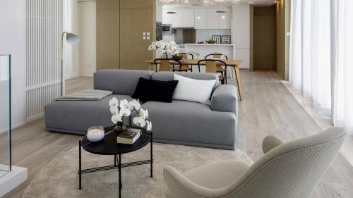 a living room with a couch and a table at Apartment on Leylek in Baku