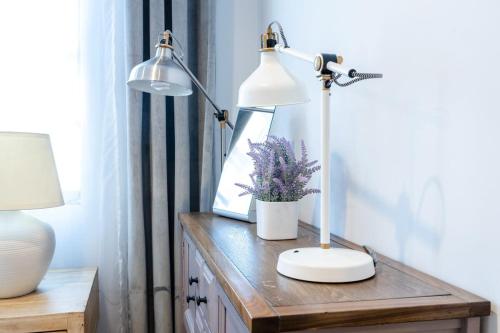 a desk with a lamp and a plant on it at 350-GA Spacious Studio Gramercy Sleeps 3 in New York