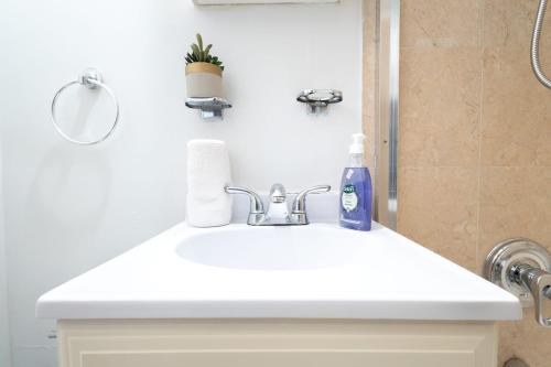 a white sink in a bathroom with a shower at 350-GA Spacious Studio Gramercy Sleeps 3 in New York