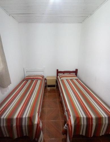 Postel nebo postele na pokoji v ubytování Chácara São José