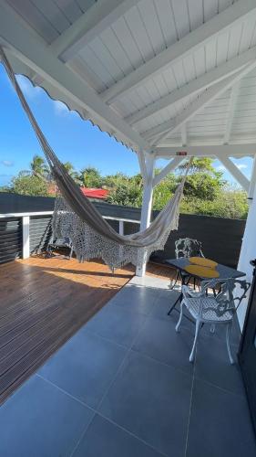 a hammock on the deck of a house at Gab house in Capesterre-de-Marie-Galante