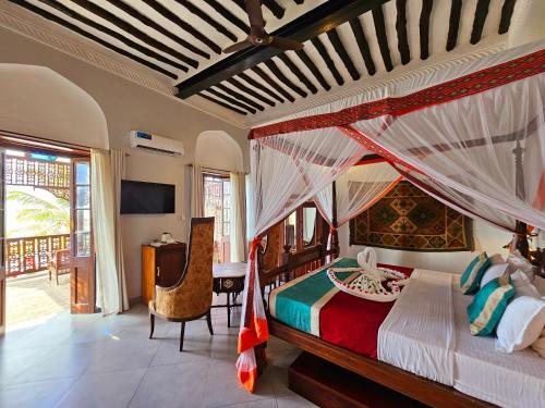 Voodi või voodid majutusasutuse Mizingani Seafront Hotel toas