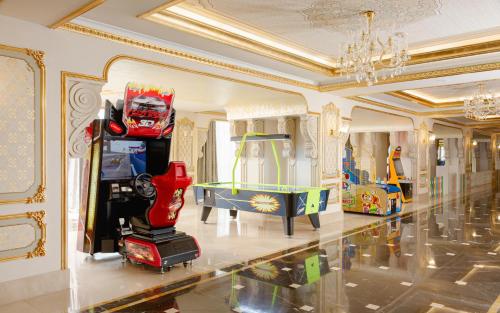 a room filled with lots of toys and a table tennishibition at Shamakhi Palace Sharadil in Şǝrǝdil