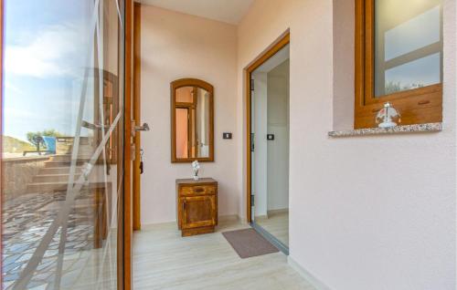 a door leading into a room with a mirror at Cozy Apartment In Koper With Sauna in Koper