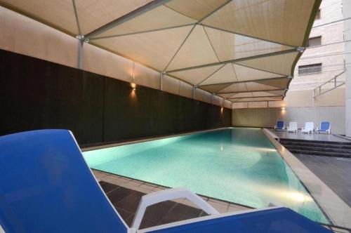 Πισίνα στο ή κοντά στο Code Housing - Fintas Dunes - Family Only - ديونز للشقق الفندقية