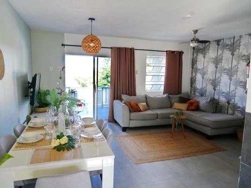 a living room with a couch and a table at 4BlessingsCuracao1 in Willemstad