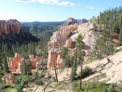 a view of a canyon with trees and rocks at Zion to Bryce cowboy cabin in Hatch