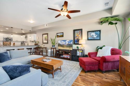 a living room with two couches and a ceiling fan at Old Town Escape with King Bed, Dog-Friendly in Fort Collins