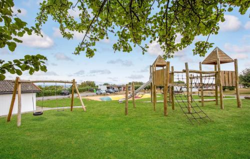 a playground with a slide in a park at Cozy Apartment In Allinge in Allinge