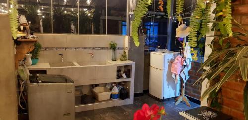 a kitchen with a sink and a refrigerator at Menacho's House in Caraz