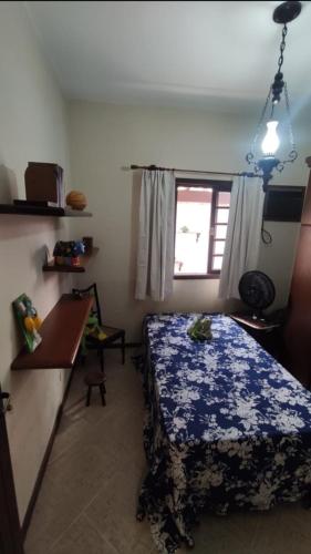 Ένα ή περισσότερα κρεβάτια σε δωμάτιο στο Casa em Jacarepaguá excelente para desfrutar o Rio de Janeiro