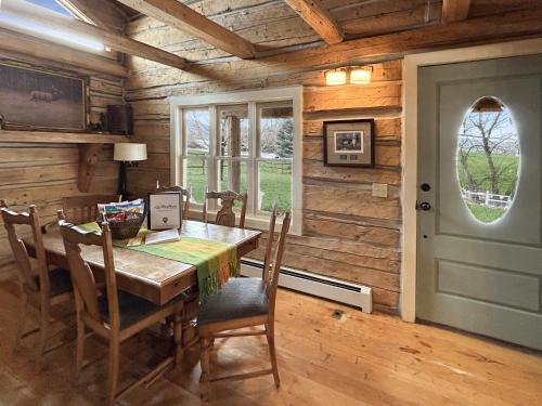 a wooden dining room with a table and chairs at Timeless Mesa Hideaway cabin in Mesa