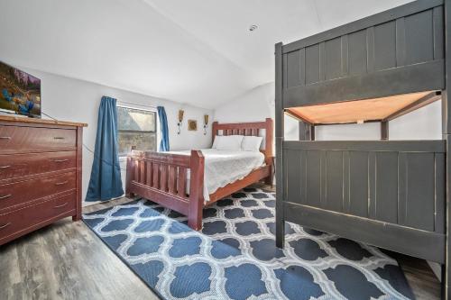 a bedroom with a bed and a bunk bed at Hidden Ranch in Sevierville
