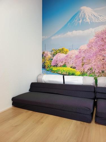 a painting of a mountain withakura trees in a room at Surf99一棟貸切80平米 一松海岸とコンビニ徒歩圏 200平米芝庭 BBQ 専用焚き火台 in Chosei