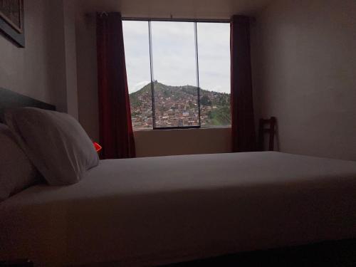 Ένα ή περισσότερα κρεβάτια σε δωμάτιο στο Adriano's Deluxe Apartments 1
