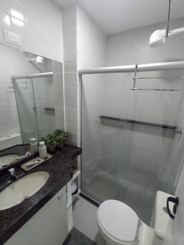 a bathroom with a shower and a toilet and a sink at Flat 08B Monte Castelo, Gravatá in Sairé