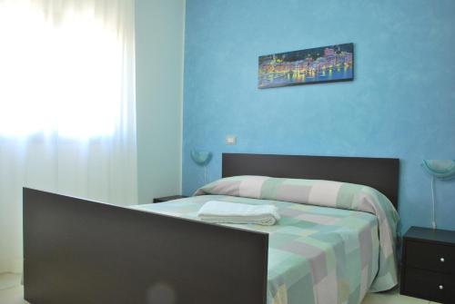 Ένα ή περισσότερα κρεβάτια σε δωμάτιο στο Case Vacanze Anni 20