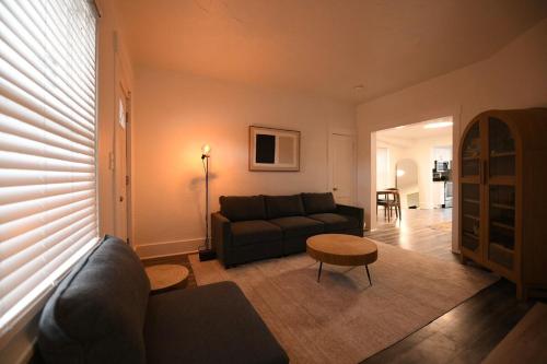 a living room with a couch and a table at Edgewater Stay on W78th in Cleveland
