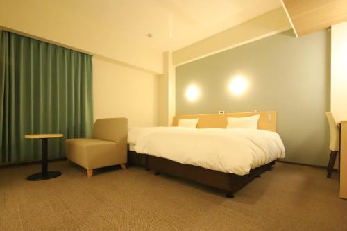 Postel nebo postele na pokoji v ubytování AB Hotel Nakatsugawa