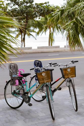 two bikes parked next to each other on a sidewalk at Le Sands Oceanfront Danang Hotel in Da Nang