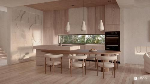 a kitchen with a table and stools in a room at Villa Julia and Villa Angelina in Leeward