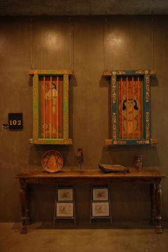 a table with two windows in a room at Olinda Galle in Galle