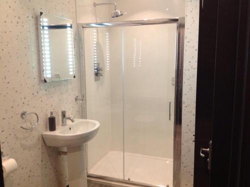 a bathroom with a shower and a sink at Rooms @ Number Six in Oakham