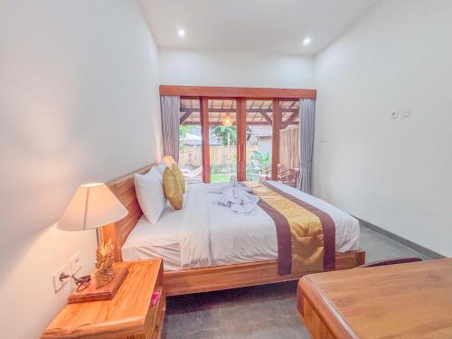Una cama o camas en una habitación de D'na Guesthouse
