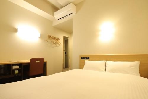 Ένα ή περισσότερα κρεβάτια σε δωμάτιο στο AB Hotel Anjo
