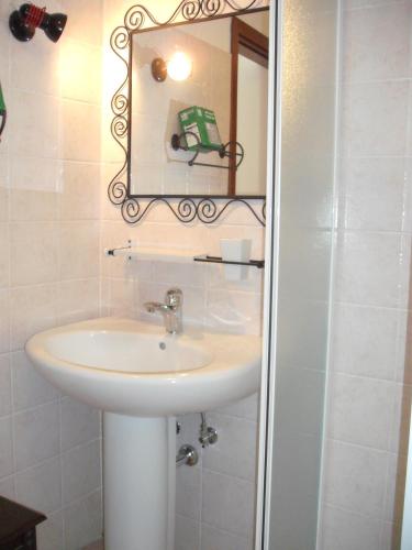 a bathroom with a sink and a mirror at Villaggio Del Sole in Giove