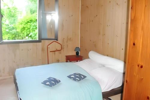 Postel nebo postele na pokoji v ubytování Maison chaleureuse à Saint Louis