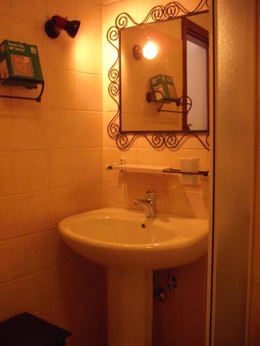 a bathroom with a sink and a mirror at Villaggio Del Sole in Giove