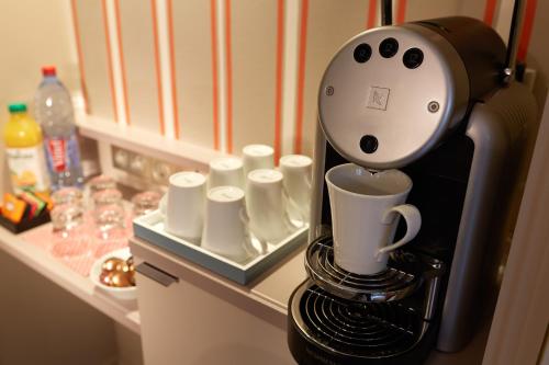 Kaffee-/Teezubehör in der Unterkunft Hôtel Vic Eiffel