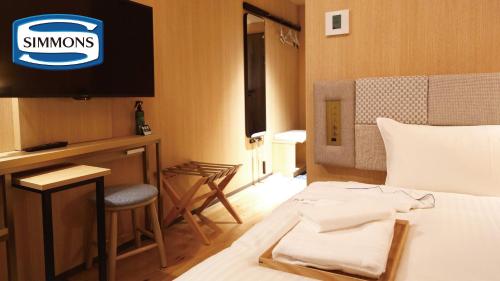 Postel nebo postele na pokoji v ubytování Hotel Nostal Yokote
