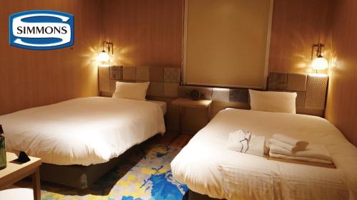 Postel nebo postele na pokoji v ubytování Hotel Nostal Yokote
