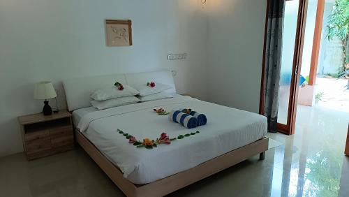 Postel nebo postele na pokoji v ubytování Saima Inn