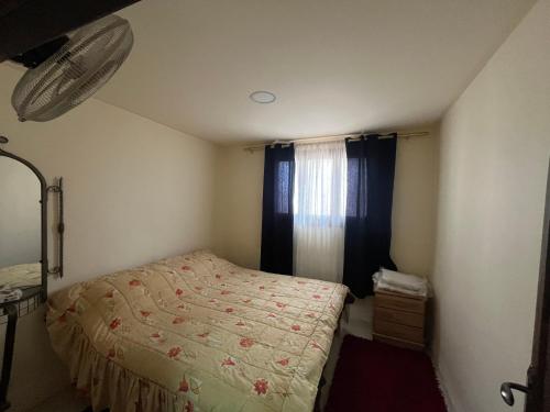 Postel nebo postele na pokoji v ubytování Al Karak House sharing Apt