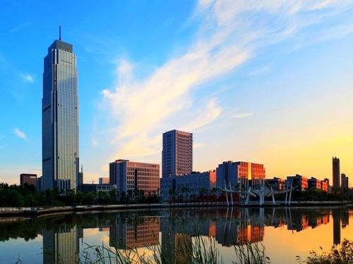 a city skyline with skyscrapers and a body of water at AOLUGUYA in Harbin