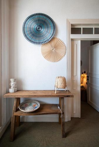 a room with a table and two umbrellas on the wall at Notarius Hotel Bodrum in Bodrum City