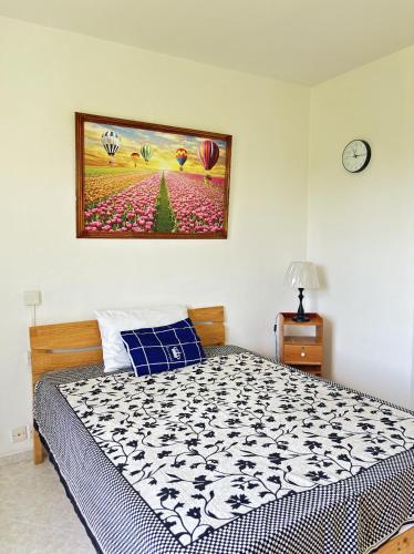 Una cama o camas en una habitación de La Clairière Tropicale 12 min de Belle Mare Plage