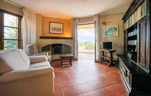 a living room with a couch and a fireplace at Villa Gioiosa in Caramagna Ligure