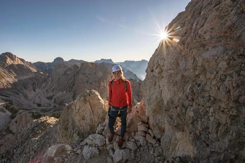 a man standing on the top of a mountain at Hotel Dosses in Tires