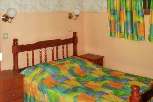Katil atau katil-katil dalam bilik di Appartement de charme à Port-Louis, 35 m², jardin privé