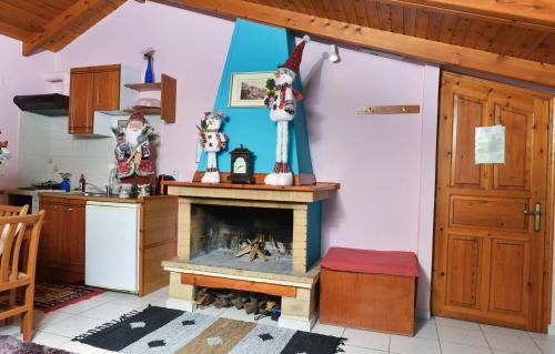 a kitchen with a fire place in a room at Patriko in Arachova